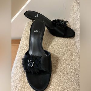 Black satin kitten heeled slides with a cute flower detail